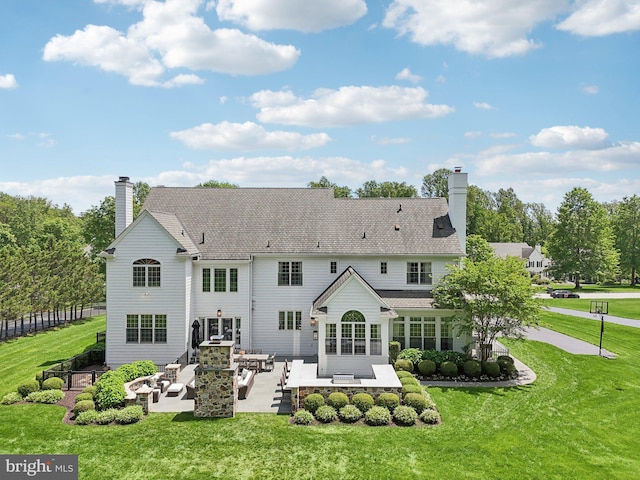 51 Farrier Ln, Newtown Square, PA 19073 - back of house with an outdoor living space, a chimney, a patio area, and a yard