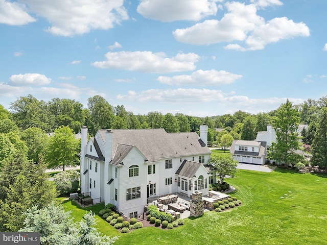 51 Farrier Ln, Newtown Square, PA 19073 - rear view of property featuring a chimney, a yard, and a patio area