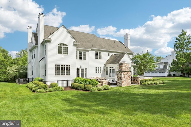 51 Farrier Ln, Newtown Square, PA 19073 - rear view of house with a chimney and a patio area