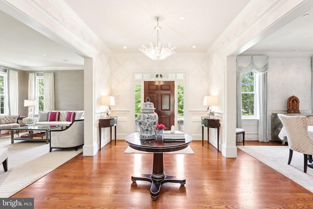 51 Farrier Ln, Newtown Square, PA 19073 - entrance foyer with plenty of natural light, wood finished floors, a chandelier, and ornamental molding