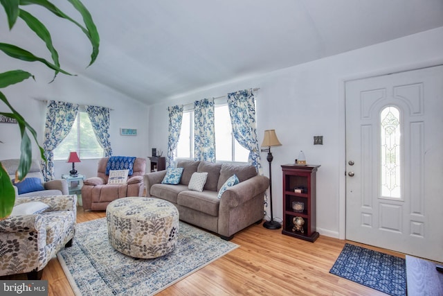 388 Monument Dr, Montross, VA 22520 - living area with healthy amount of natural light, lofted ceiling, and light wood-type flooring