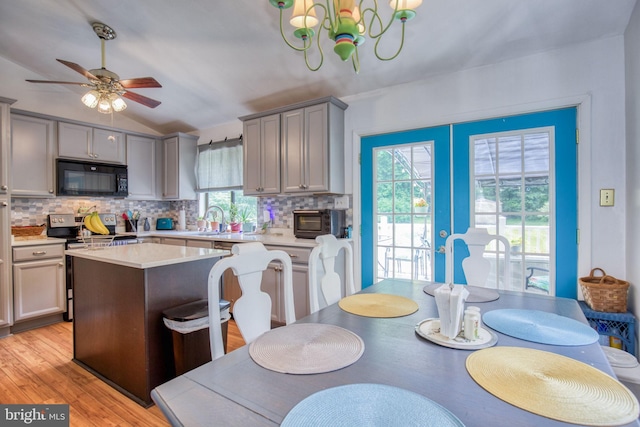 388 Monument Dr, Montross, VA 22520 - kitchen featuring black microwave, stainless steel range with electric stovetop, gray cabinetry, backsplash, and light countertops