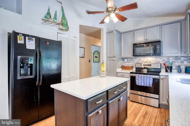 388 Monument Dr, Montross, VA 22520 - kitchen featuring black appliances, lofted ceiling, light wood-style floors, backsplash, and ceiling fan