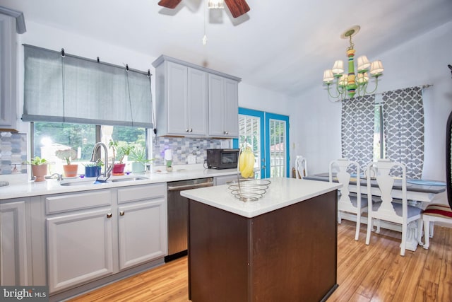 388 Monument Dr, Montross, VA 22520 - kitchen with a sink, stainless steel dishwasher, black microwave, and tasteful backsplash