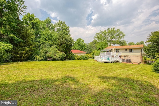 388 Monument Dr, Montross, VA 22520 - view of green lawn featuring a wooden deck