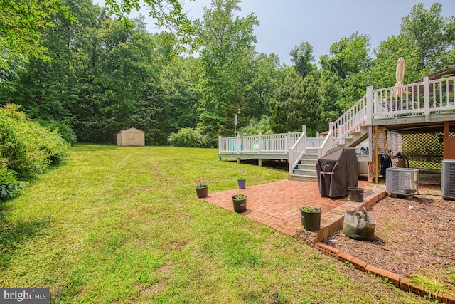 388 Monument Dr, Montross, VA 22520 - view of grassy yard featuring a patio area, a deck, stairs, and cooling unit