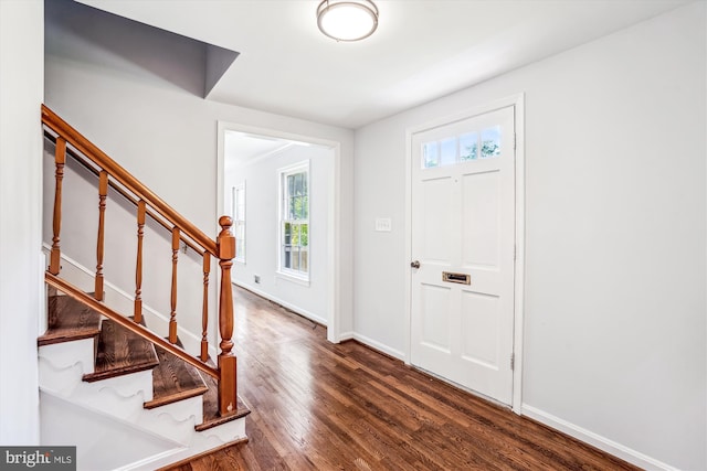 12303 Captain Smith Ct, Rockville, MD 20854 - entrance foyer with wood finished floors, stairs, and baseboards