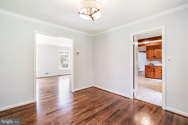 12303 Captain Smith Ct, Rockville, MD 20854 - unfurnished room with wood finished floors, crown molding, baseboards, and a chandelier