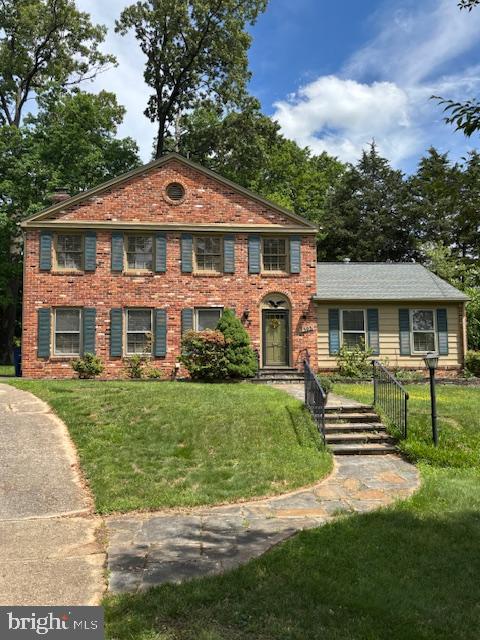12303 Captain Smith Ct, Rockville, MD 20854 - view of front of property featuring a front yard and brick siding