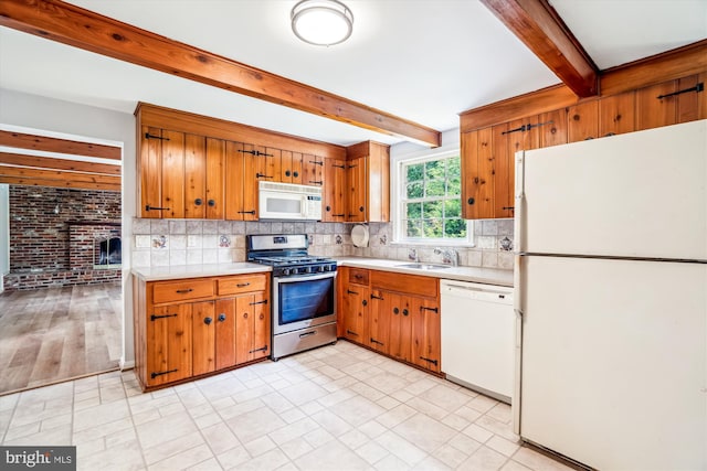 12303 Captain Smith Ct, Rockville, MD 20854 - kitchen with white appliances, beam ceiling, light countertops, decorative backsplash, and brown cabinets