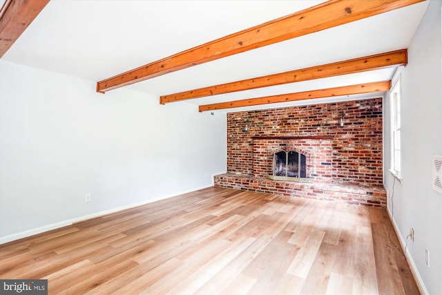 12303 Captain Smith Ct, Rockville, MD 20854 - unfurnished living room with wood finished floors, beam ceiling, a fireplace, and baseboards