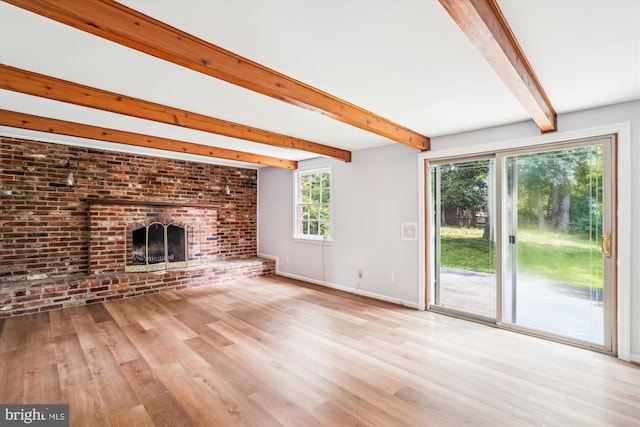12303 Captain Smith Ct, Rockville, MD 20854 - unfurnished living room with beamed ceiling, wood finished floors, a fireplace, and baseboards