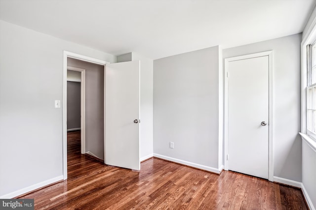 12303 Captain Smith Ct, Rockville, MD 20854 - unfurnished bedroom with wood finished floors and baseboards