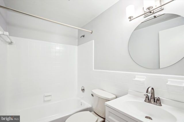 12303 Captain Smith Ct, Rockville, MD 20854 - full bath featuring toilet, bathing tub / shower combination, vanity, and a wainscoted wall