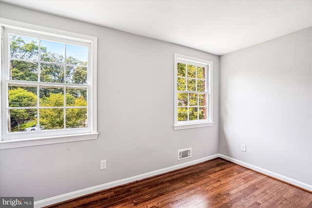 12303 Captain Smith Ct, Rockville, MD 20854 - empty room featuring plenty of natural light, baseboards, and wood finished floors