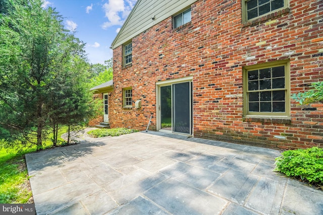 12303 Captain Smith Ct, Rockville, MD 20854 - rear view of property featuring a patio and brick siding