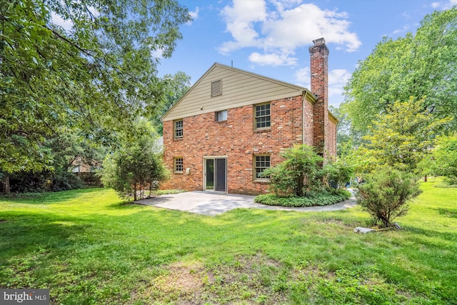 12303 Captain Smith Ct, Rockville, MD 20854 - rear view of house featuring a patio area, a chimney, brick siding, and a yard