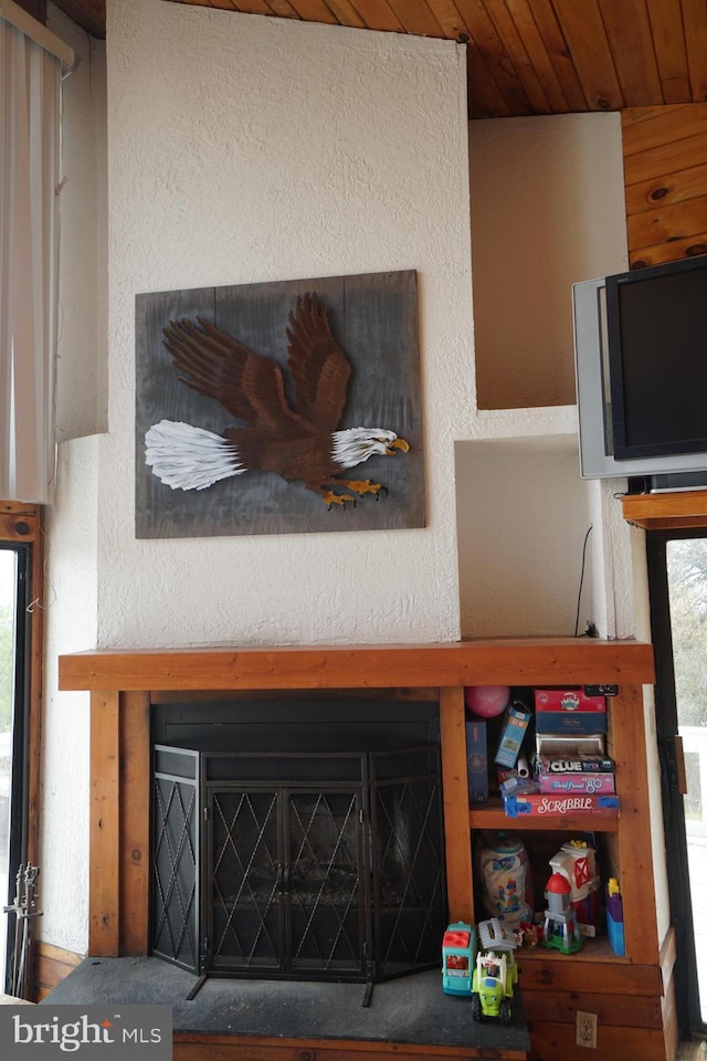 detailed view of wood ceiling and a textured wall