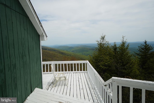 wooden terrace featuring a mountain view