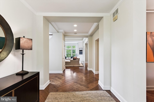 hall with baseboards, crown molding, and recessed lighting