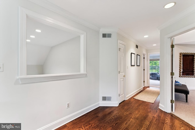 hall featuring dark wood-type flooring, recessed lighting, baseboards, and ornamental molding