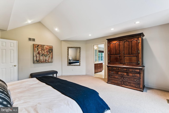 bedroom with vaulted ceiling, recessed lighting, light carpet, baseboards, and ensuite bath