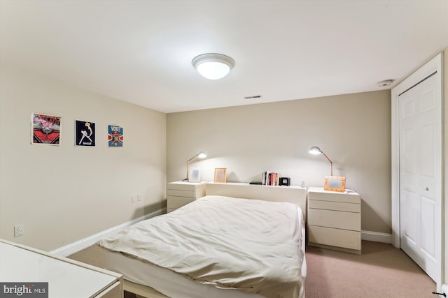 bedroom with carpet flooring and baseboards