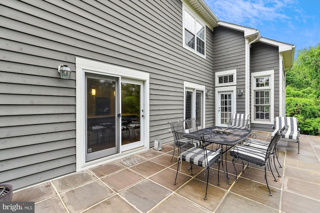 view of patio featuring outdoor dining area