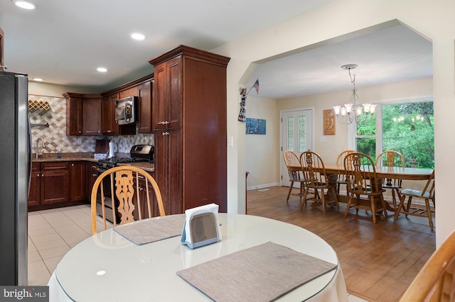 328 W Bay Front Rd, Lothian, MD 20711 - dining area with a chandelier, recessed lighting, and light wood-style floors