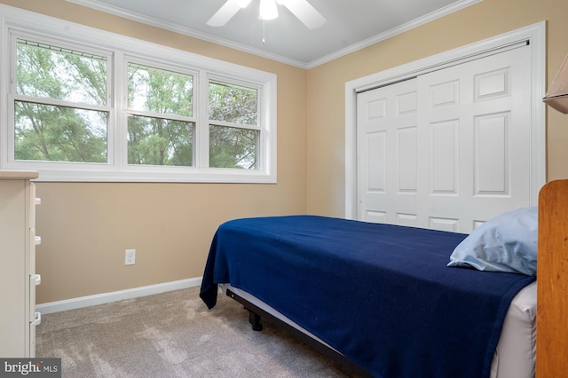 328 W Bay Front Rd, Lothian, MD 20711 - bedroom with ornamental molding, baseboards, carpet flooring, a closet, and a ceiling fan