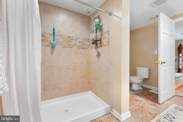 328 W Bay Front Rd, Lothian, MD 20711 - full bathroom featuring toilet, a tile shower, baseboards, and tile patterned flooring