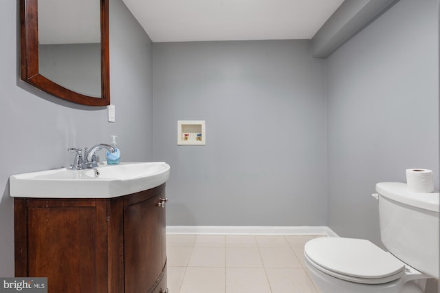 328 W Bay Front Rd, Lothian, MD 20711 - bathroom featuring toilet, vanity, tile patterned floors, and baseboards