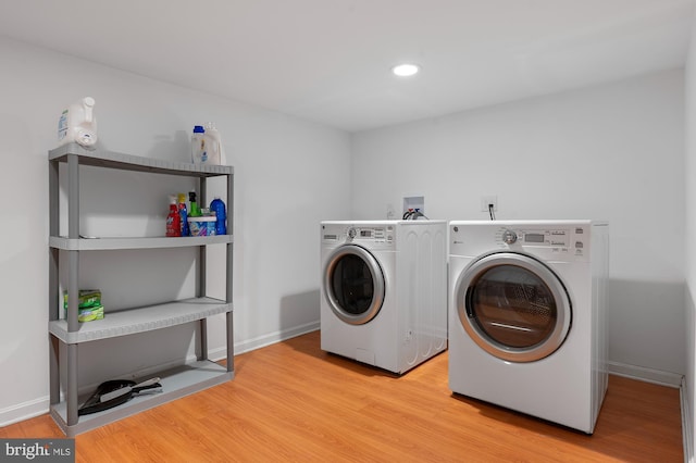 328 W Bay Front Rd, Lothian, MD 20711 - laundry room featuring washer and dryer, light wood-style floors, recessed lighting, and baseboards