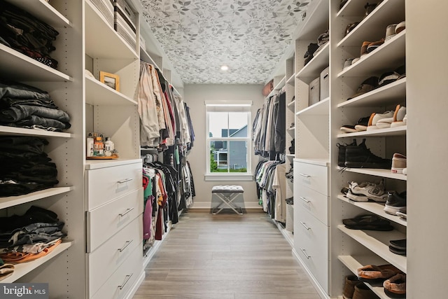 walk in closet featuring light wood-type flooring