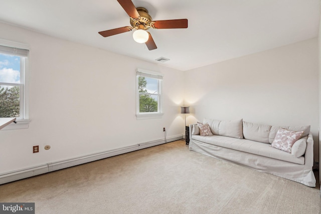 unfurnished living room featuring a baseboard radiator, carpet, and a ceiling fan