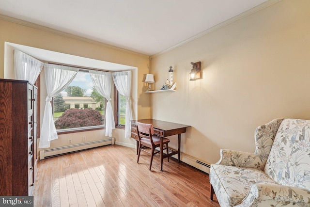 sitting room featuring a baseboard radiator, crown molding, wood-type flooring, and baseboards