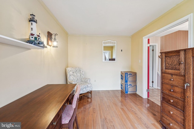 living area with crown molding and wood finished floors