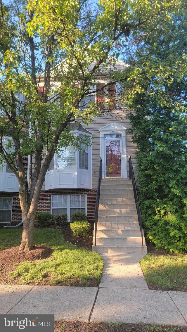 view of front of property with brick siding