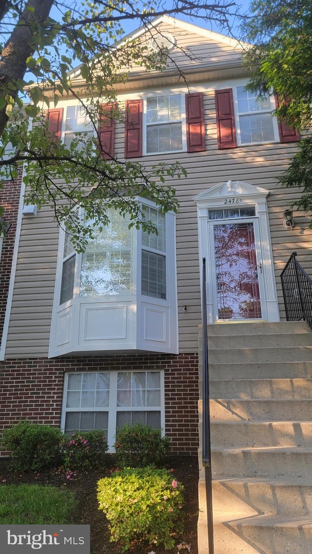 view of front of home with brick siding