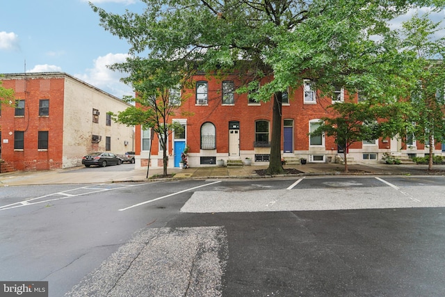 109 N Collington Ave, Baltimore, MD 21231 - view of property featuring uncovered parking