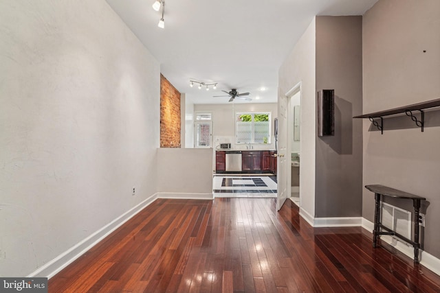 109 N Collington Ave, Baltimore, MD 21231 - unfurnished living room with dark wood-type flooring, a ceiling fan, and rail lighting