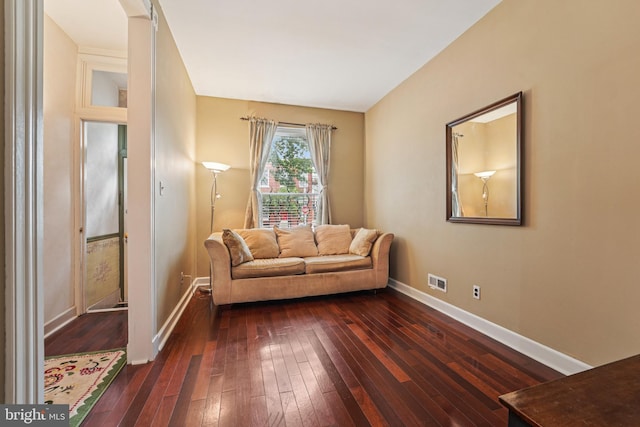 109 N Collington Ave, Baltimore, MD 21231 - living room featuring dark wood-type flooring and baseboards