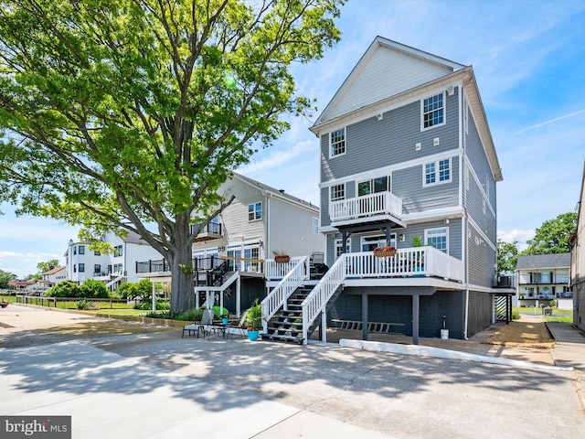 9003 Chesapeake Ave, Baltimore, MD 21219 - rear view of house featuring stairs, a deck, and a residential view