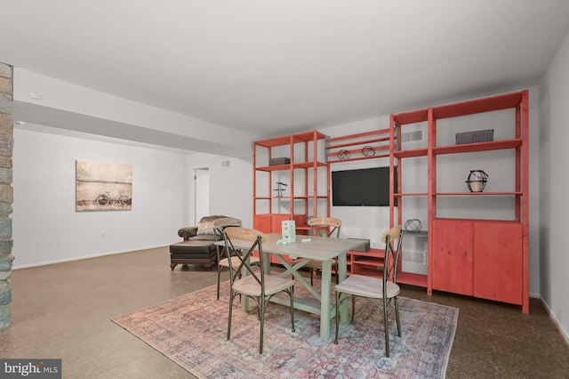 dining space featuring baseboards
