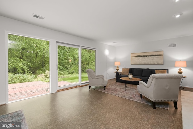 living area featuring baseboards