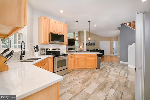 28 Blue Spruce Dr, Bear, DE 19701 - kitchen featuring stainless steel appliances, a sink, light brown cabinets, a peninsula, and recessed lighting