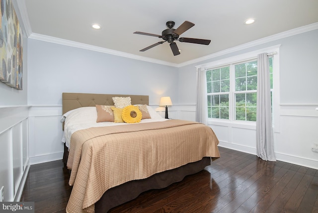 28 Blue Spruce Dr, Bear, DE 19701 - bedroom featuring a decorative wall, dark wood-style flooring, ornamental molding, a wainscoted wall, and ceiling fan