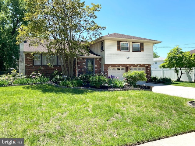 split level home featuring a garage, brick siding, and concrete driveway