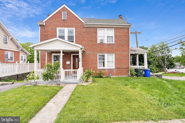 35 N Cleveland Ave, Hagerstown, MD 21740 - view of front of house featuring a porch, brick siding, a chimney, and a shingled roof