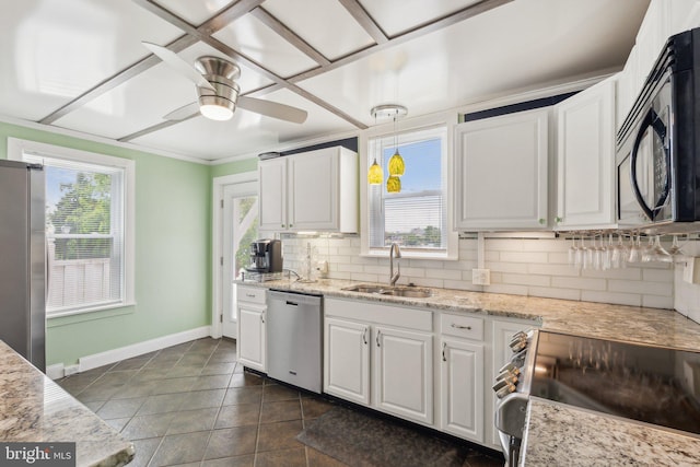 35 N Cleveland Ave, Hagerstown, MD 21740 - kitchen featuring appliances with stainless steel finishes, a sink, baseboards, decorative backsplash, and white cabinets